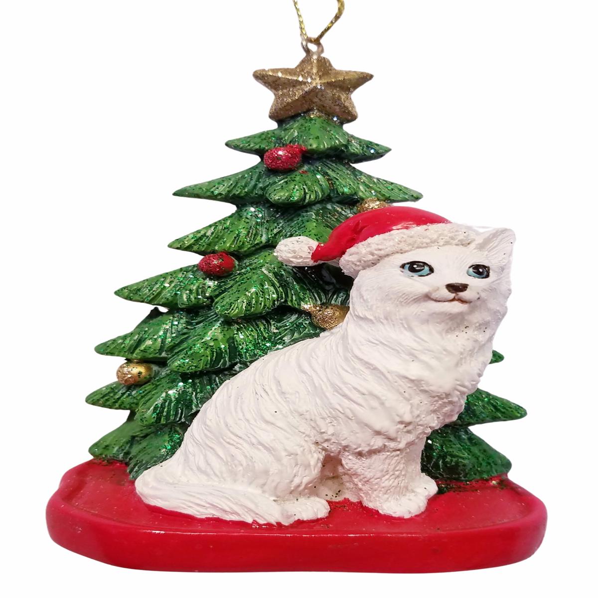 White Cat Sitting Under A Christmas Tree Ornament Wearing Red Santa Hat