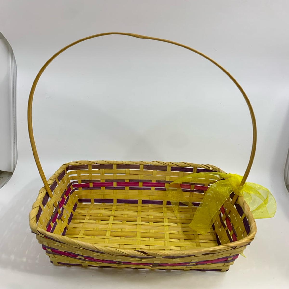 YELLOW & PURPLE WICKER BASKET W/HANDLE & RIBBON.