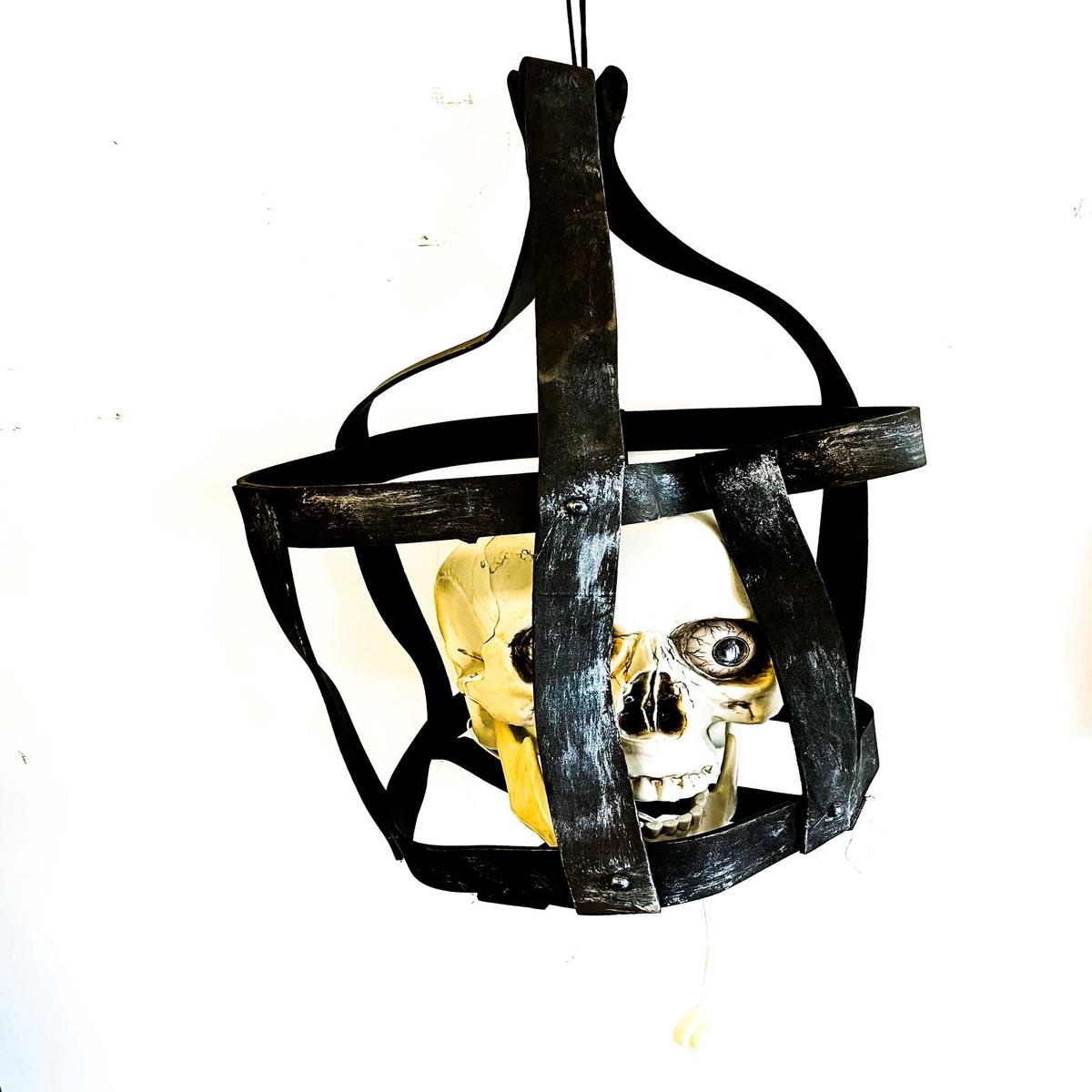 Skull in a cage with glowing eyes and movement 40cm Halloween ornaments