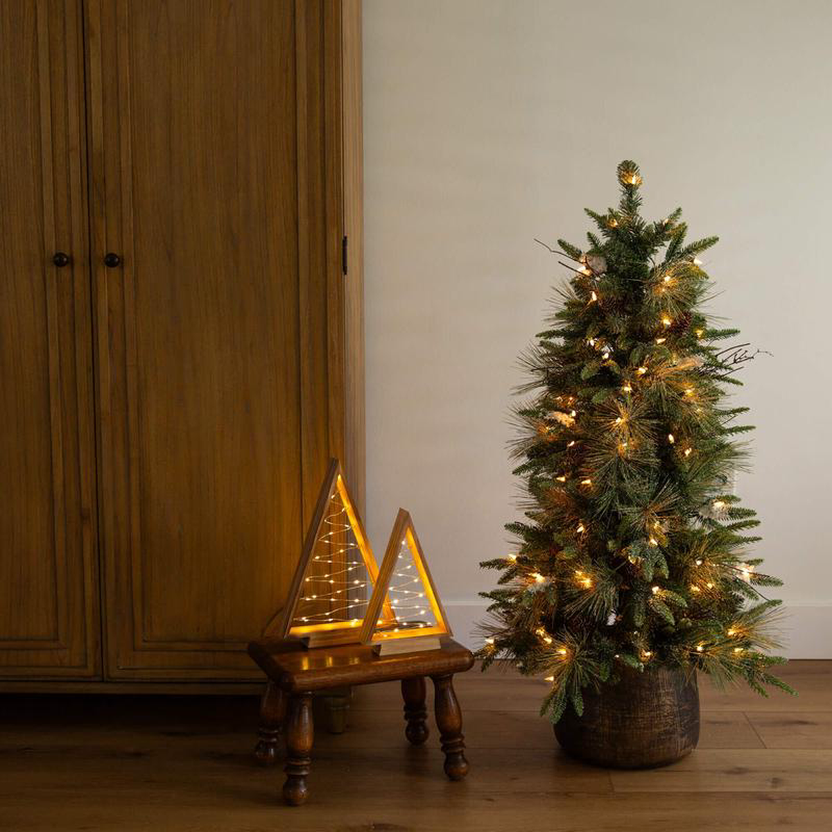 48217 Pre-Lit Artificial Mixed Pine Snowed Christmas Tree with Pinecones in Decorative Planter with 60 Warm White LED Lights